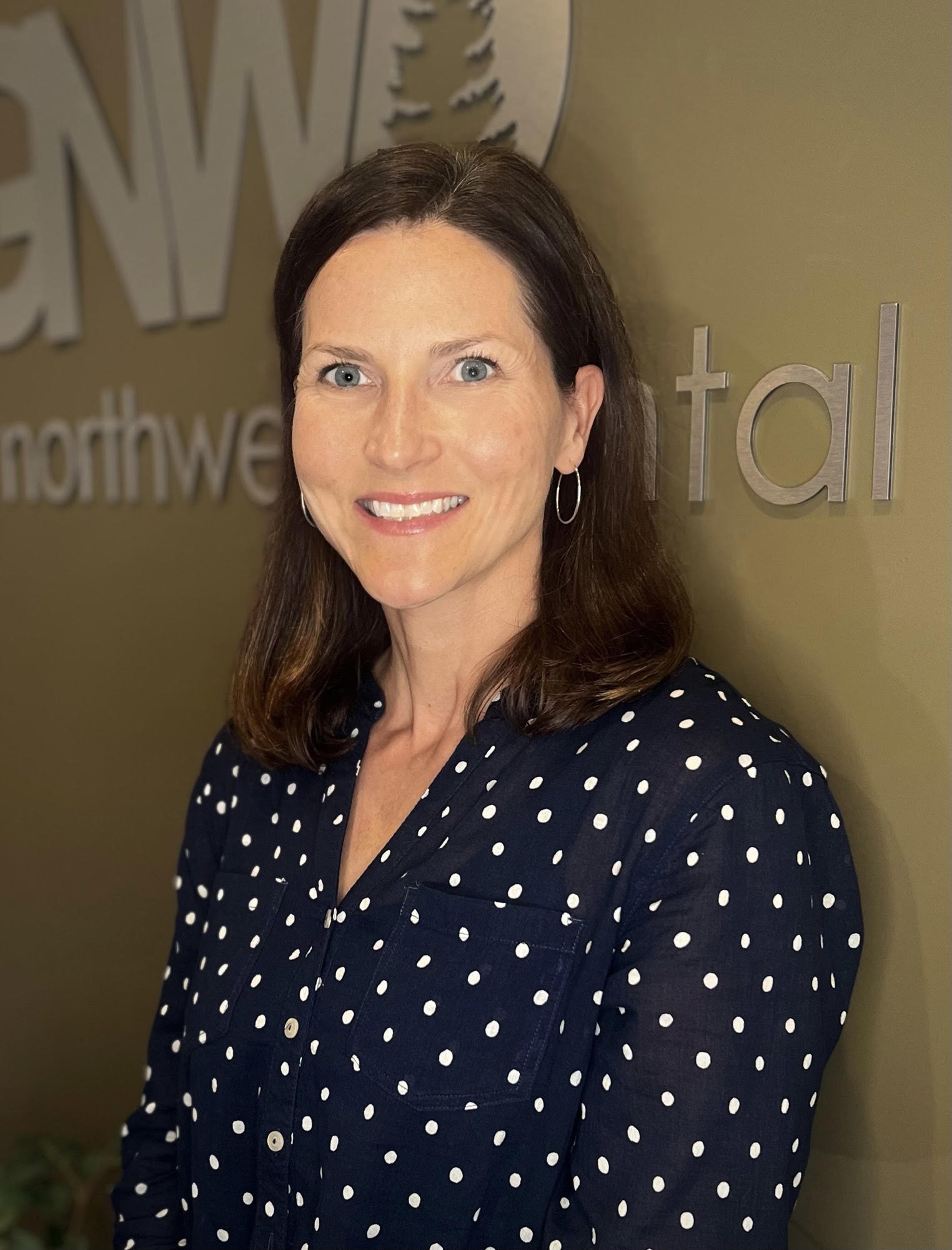 Dr Jackson Headshot A Great Northwest Dental dentist smiles for her heashot.